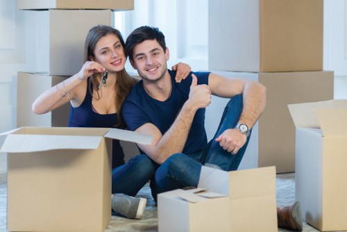 Moving van and removals team working in a Hampstead residential street
