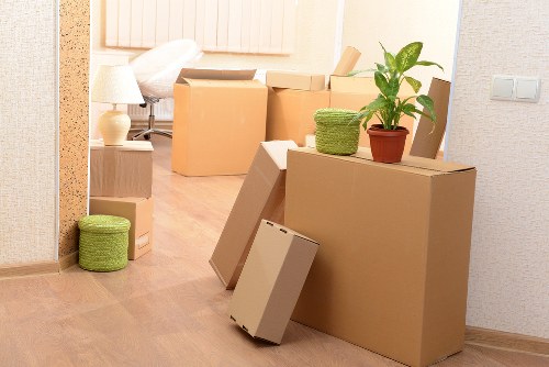 Crew separating reusable household items for charity donation